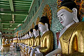 Myanmar - Sagaing, Umin Thounzeh (the 30 Caves), a colourful crescent-shaped colonnade within which there are 45 Buddha images. 